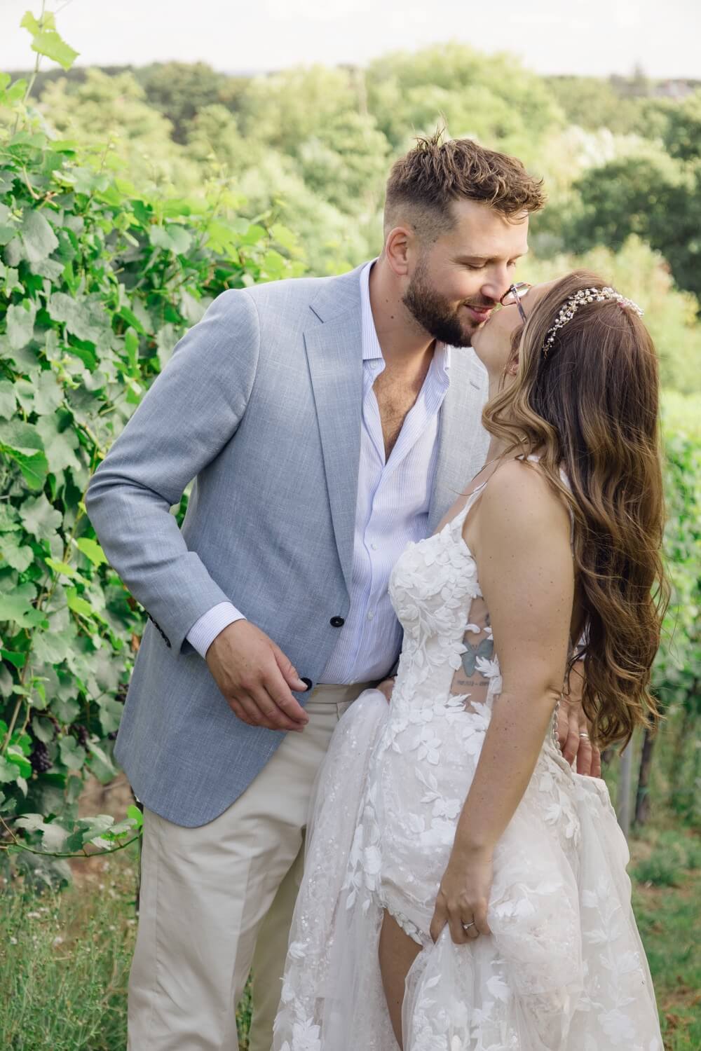 The bride and groom in the vineyard at Hencote