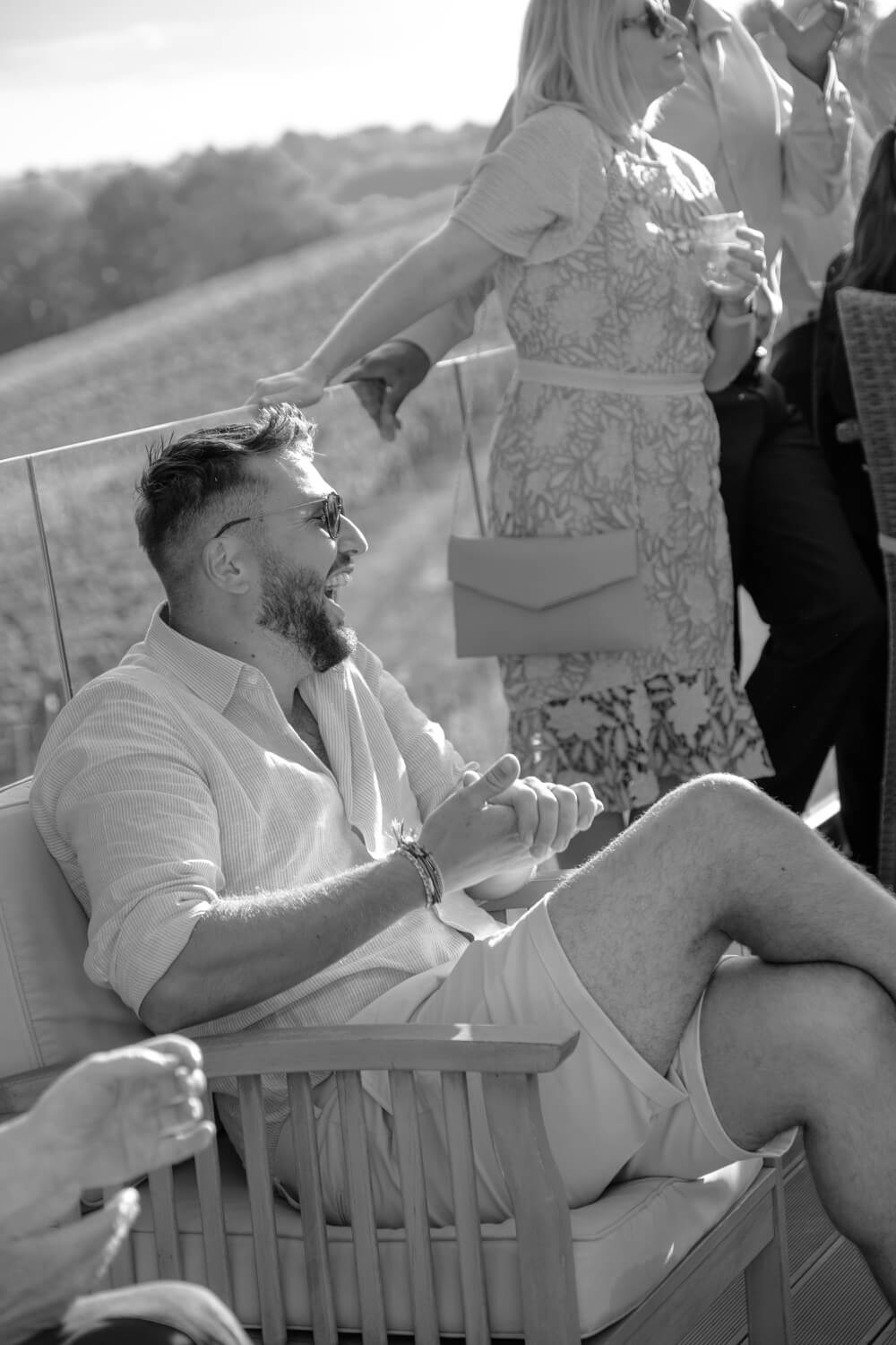 The groom laughing during the speeches